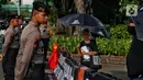 Untuk diketahui, Aksi Kamisan merupakan sebuah gerakan sosial masyarakat yang menuntut pemerintah untuk menyelesaikan kasus pelanggaran HAM masa lalu yang hingga kini belum terselesaikan. (Liputan6.com/Angga Yuniar)