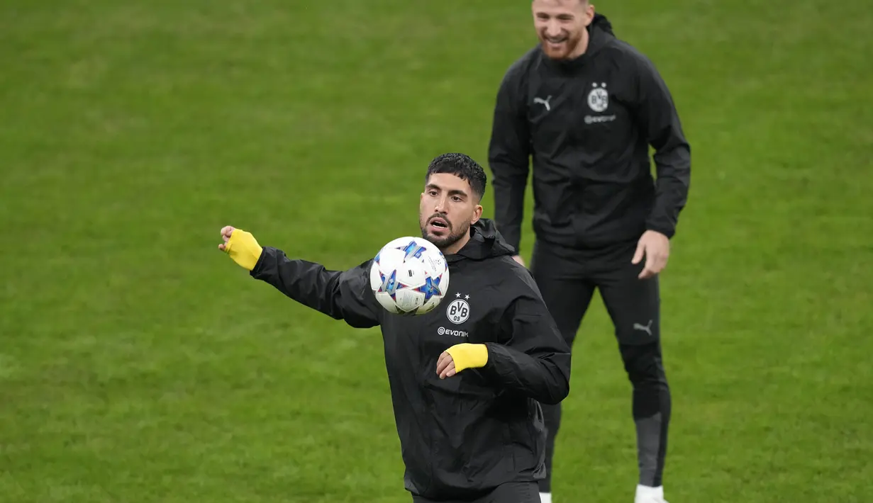 Persaingan masih sangat sengit. Milan maupun Dortmund tentunya membidik hasil terbaik dalam duel di San Siro nanti. (AP Photo/Antonio Calanni)