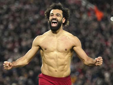 Pemain Liverpool, Mohamed Salah melakukan selebrasi setelah mencetak gol keenam timnya ke gawang Manchester United pada laga pekan ke-26 Liga Inggris 2022/2023 yang berlangsung di Anfield, Liverpool, Senin (06/03/2023) WIB. Salah kini tercatat sebagai pencetak gol terbanyak sepanjang masa Liverpool melampaui rekor Robbie Fowler setelah menyumbangkan dua gol untuk kemenangan 7-0 The Reds atas Manchester United. (AP Photo/PA/Peter Byrne)