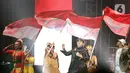 Penampilan Atta Halilintar di atas panggung YouTube FanFest 2019 di JIExpo Kemayoran, Jakarta, Jumat (29/11/2019). Work Hard Pray Hard menjadi lagu kedua yang disajikan Atta bersama Eitaro dan DJ Leztey kehadapan para penggemarnya. (Fimela.com/Bambang E.Ros)