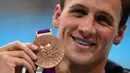 Pada London 2012, Ryan Lochte kembali memberikan AS dua medali emas. Keduanya diraih Lochte dari nomor 400m gaya ganti dan 4x200m gaya bebas. (AFP/Martin Bureau)