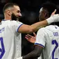 Karim Benzema dan Vinicius Jr. Duet maut Karim Benzema dan Vinicius Jr juga menggila bersama Real Madrid. Keduanya berkontribusi menjadi penyumbang gol terbanyak untuk Los Blancos. Karim Benzema total melesakkan 27 gol dan 12 assist, sedangkan tandemnya, Vinicius Jr mampu menciptakan 17 gol dan 13 assist pada musim 2021-2022. (AFP/Pierre-Philippe Marcou)