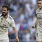 Gelandang Real Madrid, Isco, melakukan selebrasi usai membobol gawang Celta Vigo pada laga La Liga 2019 di Stadion Santiago Bernabeu, Sabtu (16/3). Real Madrid menang 2-0 atas Celta Vigo. (AP/Paul White)