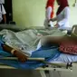 Seorang janda berusia 34 tahun kritis setelah diterkam buaya di Sungai Apung, Kabupaten Kepulauan Meranti, Riau. (Liputan6.com/M Syukur)