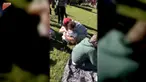 Seorang anak kecil memeluk semua orang yang dilihatnya pada sebuah taman untuk mengungkapkan salam perpisahan.