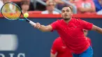 Petenis Australia, Nick Kyrgios berusaha mengembalikan bola ke arah petenis Jerman, Alexander Zverev pada turnamen Piala Rogers di Montreal, 10 Agustus 2017. Zverev sukses merebut kemenangan 6-4, 6-3 atas Kyrgios. (Paul Chiasson/The Canadian Press via AP)