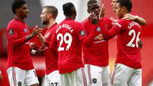Para pemain Manchester United (MU) merayakan Mason Greenwood ke gawang Bournemouth di Old Trafford, Sabtu (4/7/2020). (Clive Brunskill/Pool via AP)