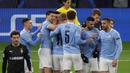 Para pemain Manchester City merayakan gol pertama ke gawang Borussia Moenchengladbach yang dicetak gelandang Kevin De Bruyne dalam laga leg kedua babak 16 besar Liga Champions 2020/2021 di Puskas Arena, Budapest, Selasa (16/3/2021). Manchester City menang 2-0 atas Gladbach. (AFP/Peter Kohalmi)