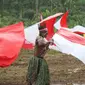 Tarian kolosal di Skow, Merauke, Papua yang masuk dalam perbatasan Indonesia-Papua Nugini. (Liputan6.com/Katharina Janur)