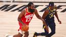 Pebasket Houston Rockets, James Harden, berusaha melewati pebasket Indiana Pacers, Justin Holiday, pada laga NBA, Rabu (12/8/2020). Houston Rockets dikalahkan Indiana Pacers dengan skor 104-108. (Kim Klement/Pool Photo via AP)