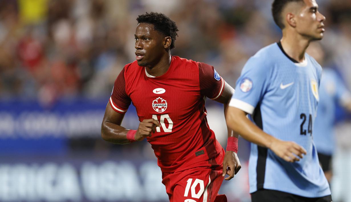 Selebrasi striker Timnas Kanada, Jonathan David setelah mencetak gol kedua timnya ke gawang Timnas Uruguay pada laga perebutan tempat ketiga Copa America 2024 di Bank of America Stadium, Charlotte, Amerika Serikat, Minggu (14/7/2024) pagi WIB. (AP Photo/Nell Redmond)