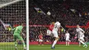 Gaya pemain Manchester United, Alexis Sanchez saat menyundul bola ke gawang Swansea City pada laga Premier League di Old Trafford, (31/3/2018).  Manchester United menang 2-0. (Anthony Devlin/PA via AP)