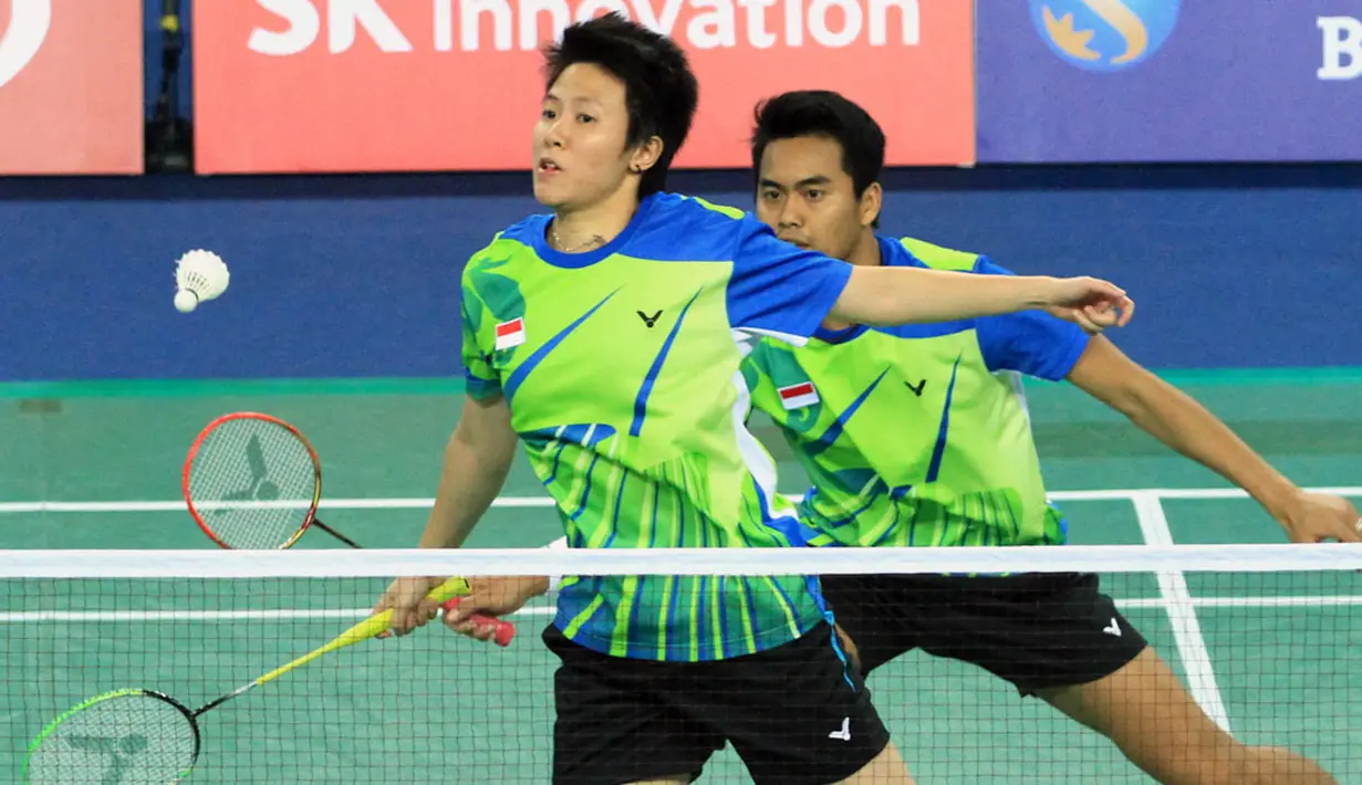 Pebulutangkis Ganda Campuran Indonesia, Tontowi Ahmad dan Liliyana Natsir, saat berlaga melawan Zhang Nan/Zhao Yunlei (Tiongkok) di Gyeyang Gymnasium, Incheon, Korea Selatan, (29/9/2014). (Dok Humas PBSI/Nafielah)
