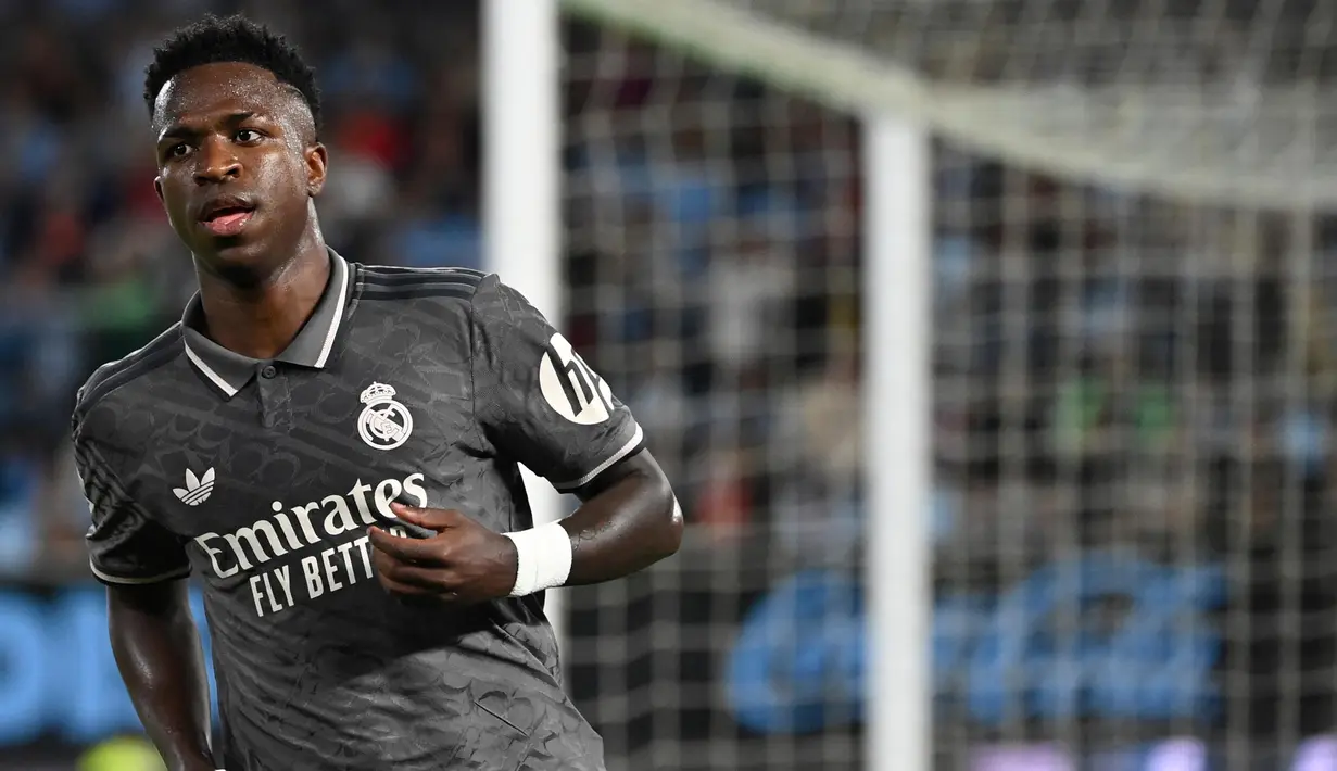 Pada menit ke-66, Vinicius Junior berhasil mencetak gol keunggulan Real Madrid. (MIGUEL RIOPA/AFP)