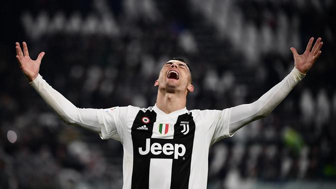 Ekspresi penyerang Juventus, Cristiano Ronaldo saat mencetak gol ke gawang Parma dalam lanjutan Serie A Italia di Allianz Stadium, Turin, Sabtu (2/2). Juventus ditahan imbang Parma dengan skor 3-3. (Marco BERTORELLO/AFP)