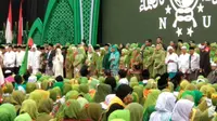 Presiden Jokowi menghadiri Harlah ke-73 Muslimat NU di GBK, Jakarta. (Liputan6.com/Putu Merta Surya Putra)