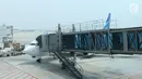 Pesawat Garuda Indonesia terparkir di Terminal 3 bandara Soekarno Hatta, Tangerang, Banten, Rabu (24/7/2019). Aturan ini merevisi kebijakan sebelumnya yang berupa imbauan tidak berfoto untuk para penumpang dan awak kabin. (Liputan6.com/Angga Yuniar)