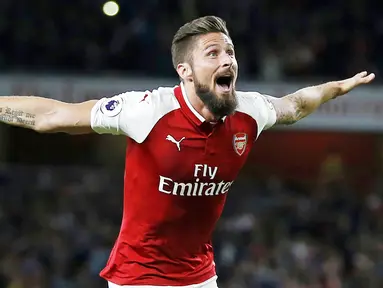 Olivier Giroud - Striker AC Milan ini sempat menjadi andalan lini serang Arsenal. Namun pada Januari 2018, Giroud memutuskan hengkang ke Chelsea dan bersama The Blues ia berhasil menggondol gelar Liga Champions. (AFP/Ian Kington)