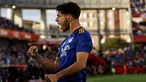 Penyerang Real Madrid Marco Asensio merayakan gol yang dicetaknya ke gawang Granada dalam laga lanjutan Liga Spanyol di Stadion Nuevo Los Carmenes, Senin (22/11/2021) dini hari WIB.  Real Madrid menang telak dengan skor 4-1 atas tuan rumah Granada. (AP Photo/Fermin Rodriguez)