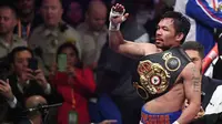 Petinju Manny Pacquiao merayakan kemenangan atas Keith Thurman dalam pertarungan gelar tinju Super World kelas Welter WBA di MGM Garden Arena, Las Vegas, Sabtu (20/7/2019). Setelah melalui duel 12 ronde, Pacquiao selaku penantang gelar berhasil keluar sebagai pemenang (Ethan Miller/Getty Images/AFP)