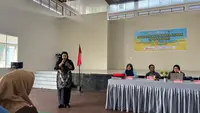 Sosialisasi kanal aduan SP4N-LAPOR! oleh Diskominfo Kaltim di Desa Sangatta Selatan, Kabupaten Kutai Timur.