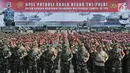 Prajurit TNI dan personel Polri melaksanakan Apel Patroli Skala Besar TNI-Polri di JIExpo, Kemayoran, Jakarta Pusat, Minggu (14/4). TNI dan POLRI siap mengamankan pelaksanaan Pemilu serentak  17 April 2019 mendatang dengan menjamin keamanan masyarakat sampai ke TPS. (merdeka.com/Iqbal S. Nugroho)