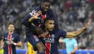 Pemain PSG Achraf Hakimi merayakan gol bersama Ousmane Dembele saat final Liga Champions melawan Inter Milan di Allianz Arena, Minggu, 1&nbsp;Juni 2025. (AP Photo/Matthias Schrader)