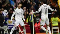 Gaya selebrasi Cristiano Ronaldo setelah mencetak gol untuk Real Madrid, 6 Desember 2014. Gaya ini menjadi ciri khas CR7. (AFP/Javier Soriano)