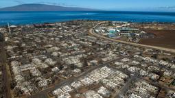 Jumlah korban tewas kebakaran hutan Hawaii masih terus meningkat hingga mencapai 101 orang. Kebakaran tersebut menyambar dengan cepat karena terbawa angin dan sistem peringatan kebakaran hutan di Hawaii dilaporkan tidak berfungsi. (AP Photo/Jae C. Hong)
