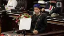 Presiden Joko Widodo membacakan pidato saat Sidang tahunan MPR RI 2021 di Gedung Nusantra, Senayan, Jakarta, Senin (16/8/2021). Jokowi mengaku baju adat Baduy itu disiapkan khusus oleh Jaro Saija, tetua adat masyarakat Baduy sekaligus Kepala Desa Kanekes. (Liputan6.com/Angga Yuniar)