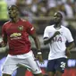 Paul Pogba  bisa bikin MU tak seimbang kalau hengkang (HECTOR RETAMAL / AFP)