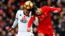 Pemain Liverpool, Emre Can (kanan), berduel dengan pemain Watford, Etienne Capoue, di Stadion Anfield pada laga lanjutan Premier League 2016-2017, Minggu (6/11/2016). (Action Images via Reuters/Jason Cairnduff)