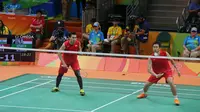 Hendra Setiawan/Mohammad Ahsan sukses melalui rintangan awal pada ajang Olimpiade Rio de Janeiro 2016. (Bola.com/Twitter/Komite Olimpiade Indonesia)