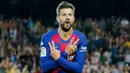 Gerard Pique - Bek tangguh ini merupakan salah satu produk terbaik yang pernah dihasilkan La Masia. Pemain yang sempat disia-siakan MU ini akhirnya pulang ke Camp Nou dan meraih segudang trofi bersama Barcelona. (AFP/Pau Barrena)