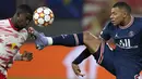 Penyerang Paris Saint Germain (PSG) Kylian Mbappe berebut bola dengan bek RB Leipzig Nordi Mukiele pada matchday keempat Grup A Liga Champions di Sheriff Stadium, Kamis dinihari WIB (4/11/2021). PSG harus puas dengan skor imbang 2-2. (AP Photo/Michael Sohn)