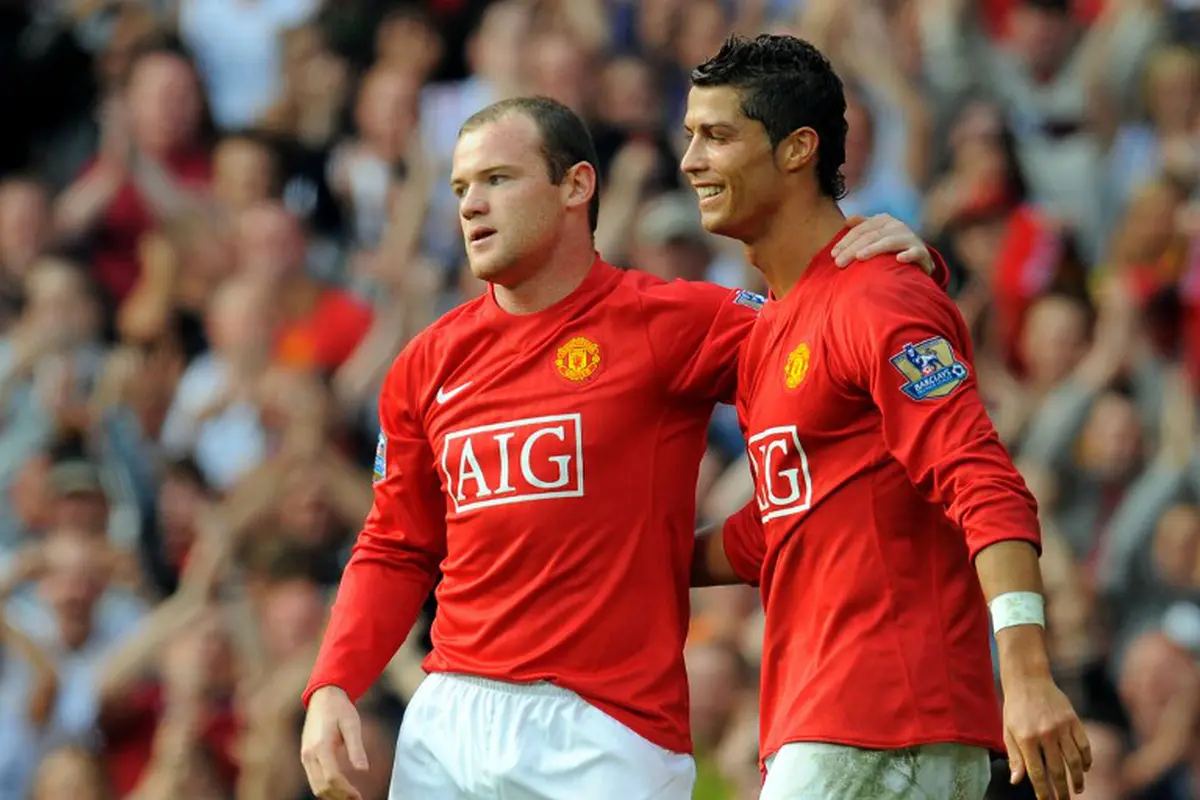 Wayne Rooney dan Cristiano Ronaldo (AFP PHOTO/ANDREW YATES)