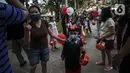 Seorang anak mengenakan kostum unik saat mengikuti Parade Kostum Halloween di Mall Central Park, Jakarta, Sabtu (30/10/2021). Kegiatan ini mengusung tema dan konsep dari perayaan Halloween sebelumnya. (Liputan6.com/Johan Tallo)