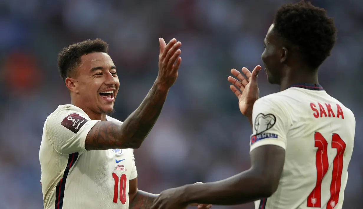 Pada menit ke-78 Jesse Lingard memperbesar jarak menjadi 3-0 usai mencetak gol keduanya. Ia melepaskan sepakan terukur ke pojok kiri gawang Andorra yang gagal diantisipasi Josep Gomes. (Foto: AP/Ian Walton)