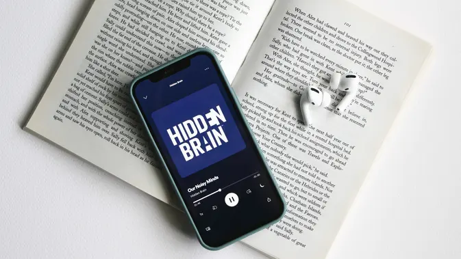 Listening to Hidden Brain Podcast on Spotify (Photo by Elnaz Asadi on Unsplash)