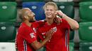 Penyerang Norwegia, Erling Braut Haaland, merayakan gol yang dicetaknya ke gawang Irlandia Utara pada laga UEFA Nations League di Windsor Park, Selasa (8/9/2020) dini hari WIB. Norwegia menang telak 5-1 atas Irlandia Utara. (AFP/Paul Faith)