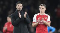 Selebrasi pelatih Arsenal, Mikel Arteta (kiri) bersama Leandro Trossard merayakan kemenangan 2-0 atas Luton Town setelah berakhirnya laga pekan ke-31 Premier League 2023/2024 di Emirates Stadium, London, Rabu (3/4/2024) malam. (AP Photo/Frank Augstein)