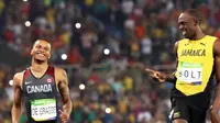 Pelari Jamaika, Usain Bolt, mengobrol dengan atlet Kanada, Andre de Grasse, saat lomba lari 200 meter Olimpiade Rio de Janeiro 200 meter, Rabu (17/8/2016) waktu setempat. (EPA/SRDJAN SUKI)