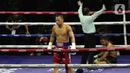 Petinju Indonesia, Daud Yordan saat menumbangkan perlawanan Panya Uthok (Thailand) pada laga mempertahankan gelar WBC Asia Boxing Council Silver Super Lightweight di Balai Sarbini, Jakarta, Jumat (1/7/2022). Daud Yordan menang KO pada ronde keenam. (Liputan6.com/Helmi Fithriansyah)
