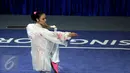 Ekspresi atlet wushu Indonesia, Lindswell Kwok saat tampil di nomor pedang TaijiJian SEA Games 2015 di SingaporeExpo, Singapura, Senin (8/6/2015). Lindswell Kwok berhasil meraih medali emas keduanya di SEA Games 2015. (Liputan6.com/Helmi Fithriansyah)