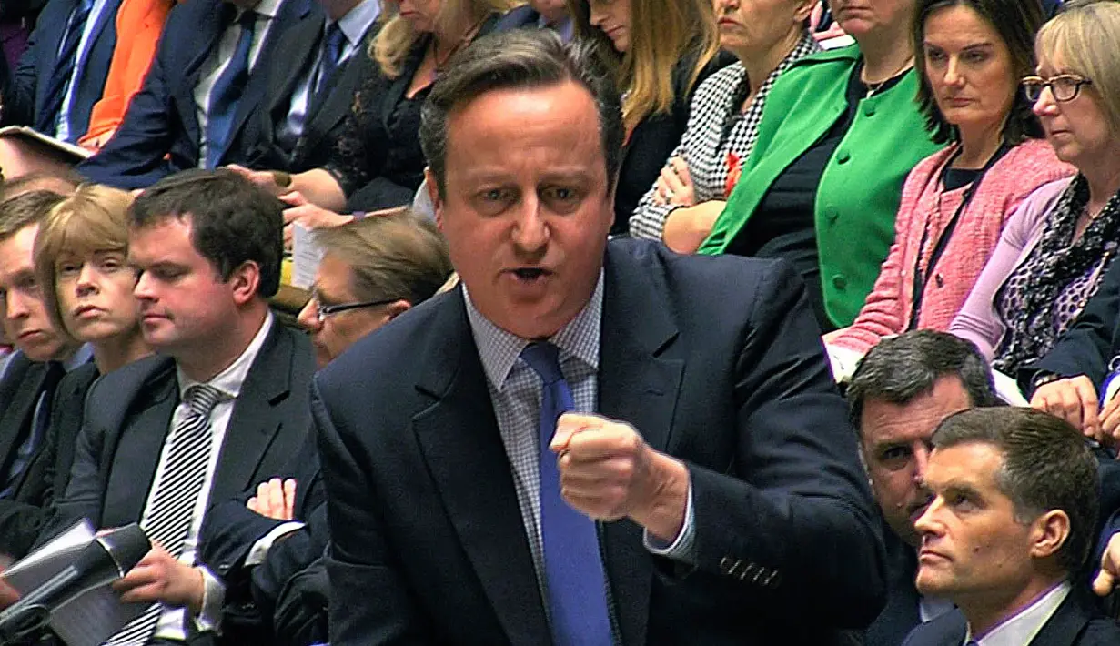 Perdana Menteri Inggris, David Cameron berbicara saat pemungutan pemerintah Inggris pada aksi militer terhadap Negara Islam (IS) Suriah di London (2/11). Pemungutan suara digelar usai debat selama lebih dari 10 jam. (AFP PHOTO/PRU)
