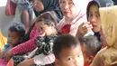 Anak balita bersama ibunya di Puskesmas, Kaduhejo, Pandeglang (14/9). Kondisi gagal tumbuh kronis yang irreversible, tanpa pengetahuan orang tua, tenaga kesehatan, serta fasilitas dan ketersediaan pangan yang memadai. (Foto:Istimewa)