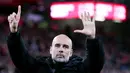 Pelatih Manchester City, Pep Guardiola, memberi respon menohok kepada penggemar Liverpool usai ia diejek dalam pertandingan antara City vs Liverpool pada Minggu (1/12/2024). (AP Photo/Ian Hodgson)