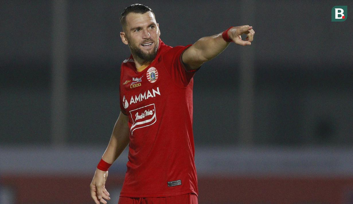 Penyerang Persija Jakarta, Marko Simic melakukan selebrasi usai mencetak gol kedua timnya ke gawang PSIS Semarang dalam laga pekan kedua BRI Liga 1 2021/2022 di Indomilk Arena, Tangerang, Minggu (12/9/2021). Kedua tim bermain imbang 2-2. (Foto: Bola.Com/M