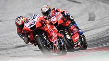 Jack Miller versus Andrea Dovizioso pada balapan MotoGP Austria, 16 Agustus lalu. (Joe Klamar / AFP)