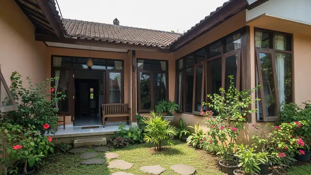 Rumah Desa Pola L dengan Taman Tengah